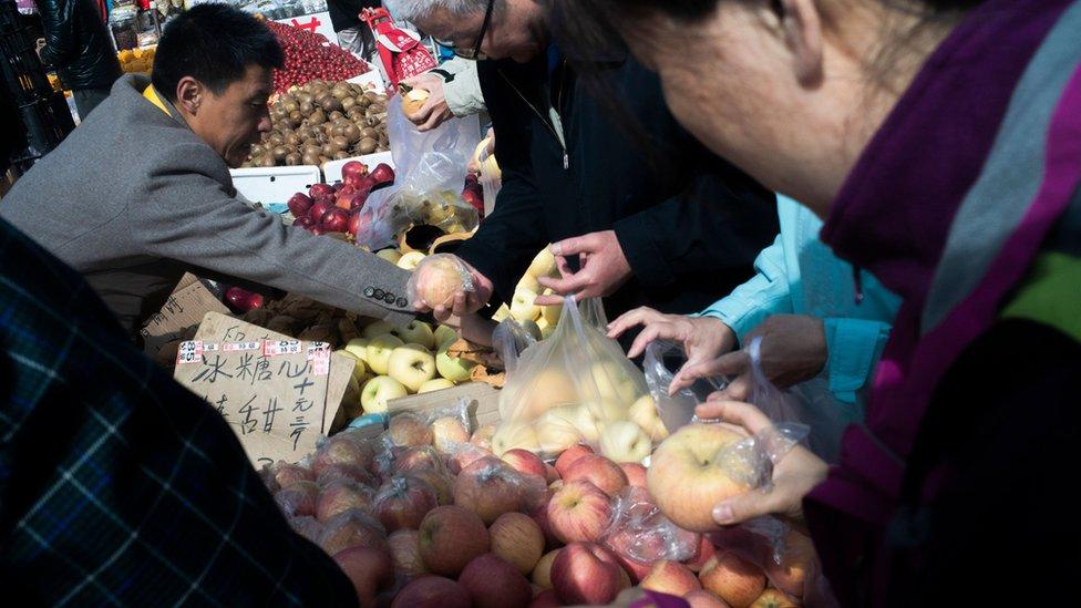 Chinese shoppers and market traders