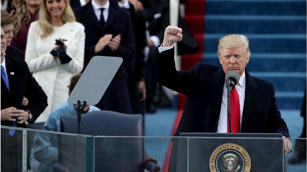 Trump raises fist at inauguration