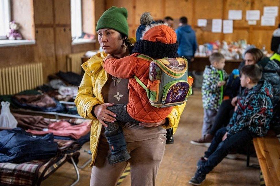 Refugees at a Polish-Ukrainian border crossing