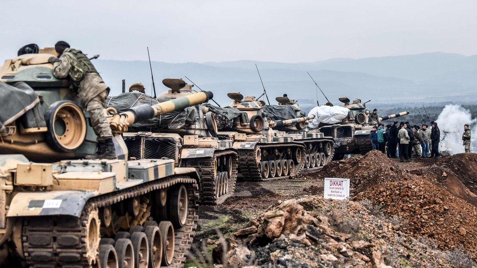 Turkish troops gather near the Syrian border at Hassa, in Hatay province, 21 January 2018