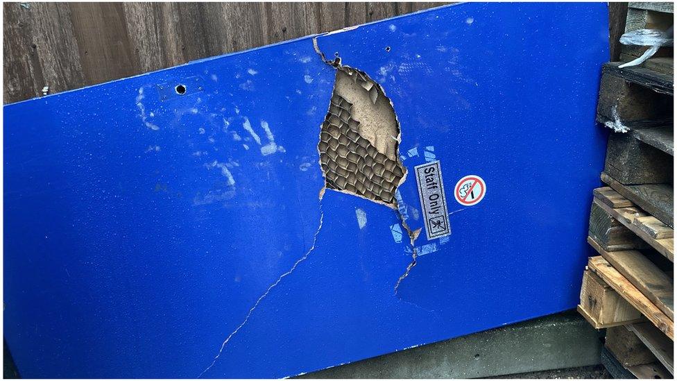 Damaged interior door at Farleigh Hospice's warehouse in Maldon.