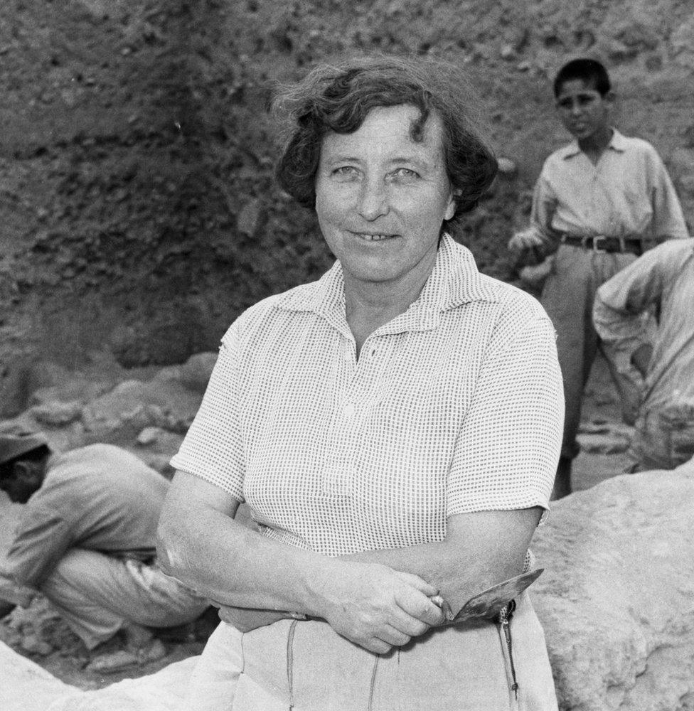 Archaeologist Kathleen Kenyon excavating a site in Jericho.