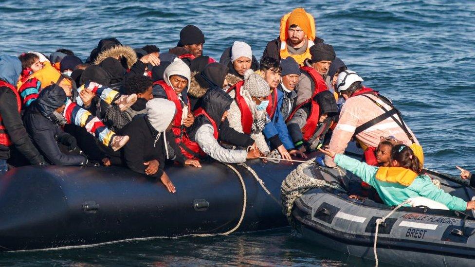 Migrants are rescued by crew members of the Abeille Languedoc ship after their boat's generator broke down in French waters while they were trying to cross the Channel illegally to Britain, off the coasts of Boulogne-sur-Mer, northern France, on May 9, 2022