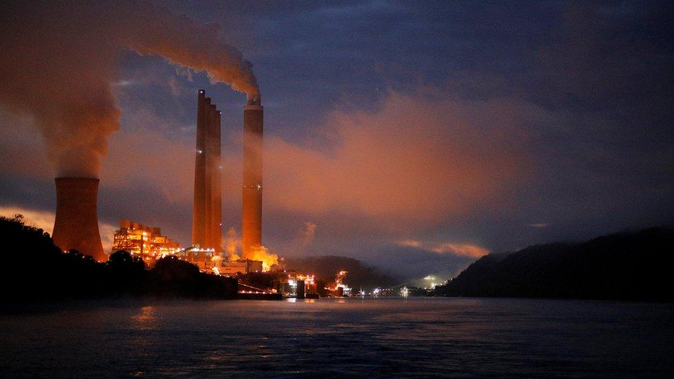 The Dayton Power & Light J.M. Stuart Station, a coal fired power plant and according to news reports, due to be shut down in 2018, lights up the early morning sky on the banks of the Ohio River in Aberdeen, Ohio, U.S., September 13, 2017