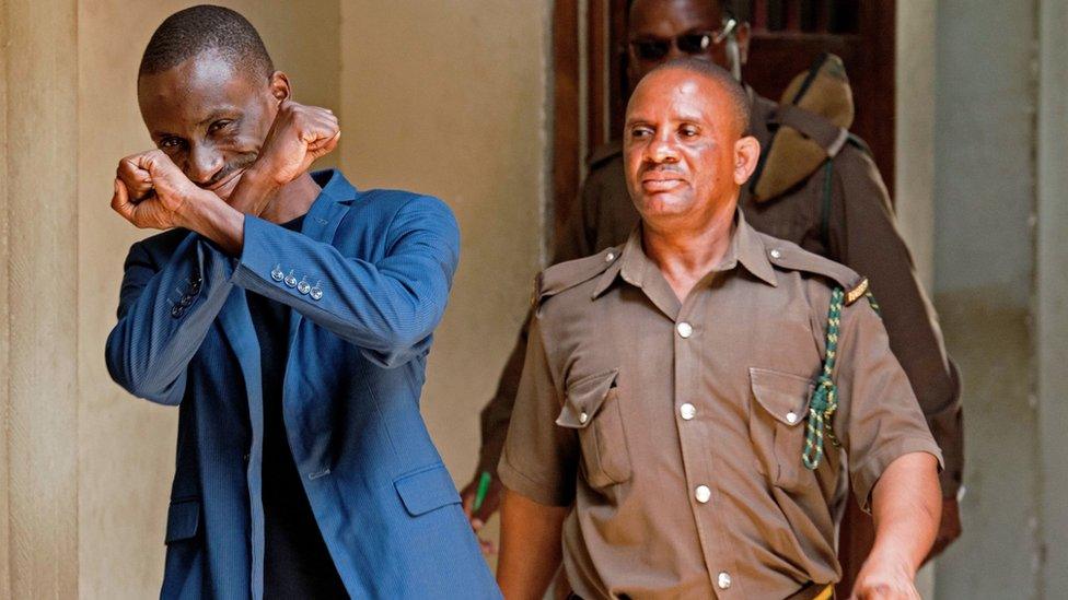 Maxence Melo gestures prior to appearing in court for his bail hearing in Dar es Salaam in 2016