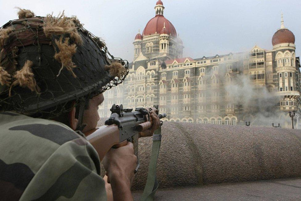 An Indian army soldier holds positions outside The Taj Mahal hotel in Mumbai on November 29, 2008. Indian commandos have killed the last Islamic militants holed up inside Mumbai's Taj Mahal hotel, ending the more than two-day assault on India's financial capital, the city's police chief told AFP.