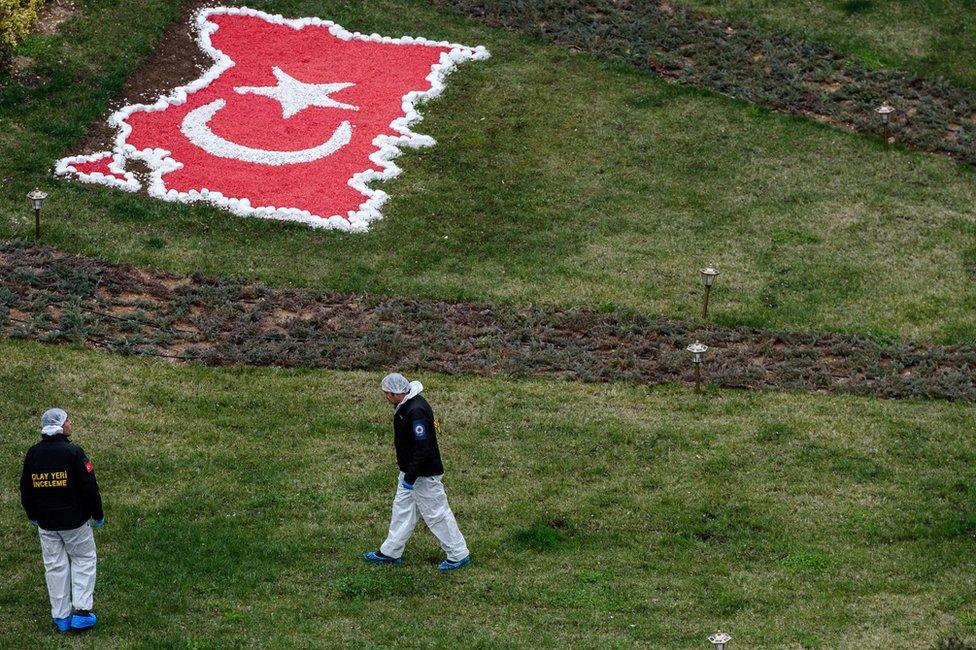 Investigators at the scene of a suicide car bomb in the Turkish capital Ankara