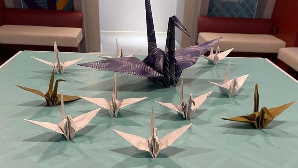 Paper origami cranes left by Japan