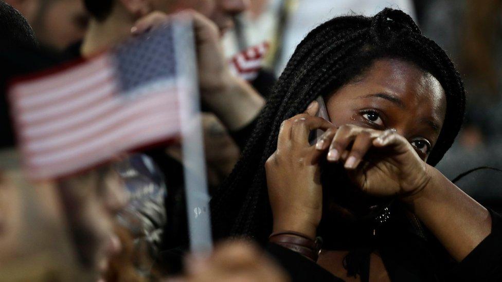 A woman weeps as election results are reported