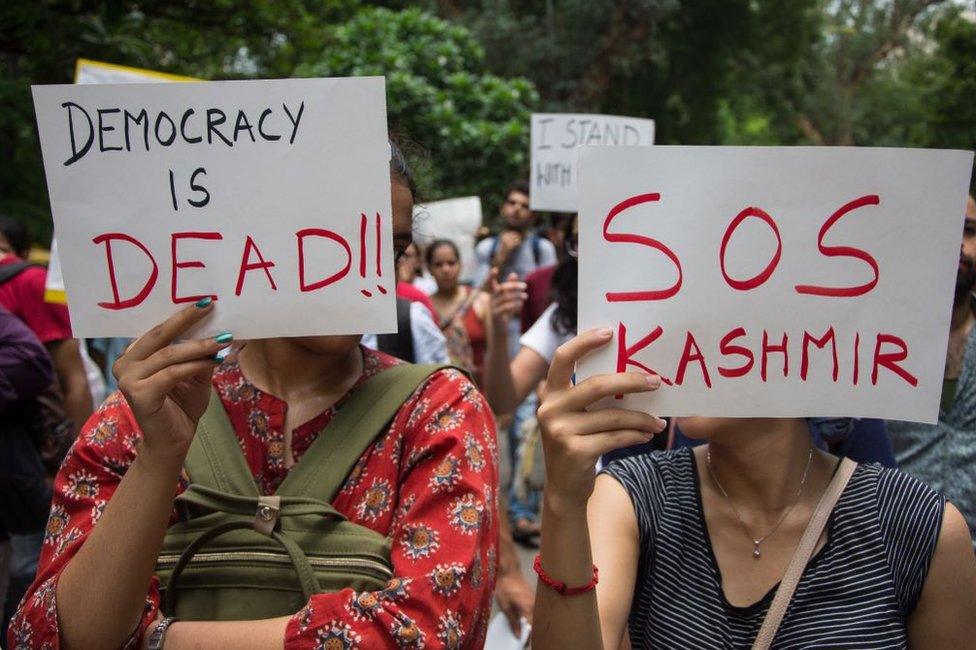 People attend a protest in solidarity with Kashmir over the removal of Article 370 in Delhi on 7 August.