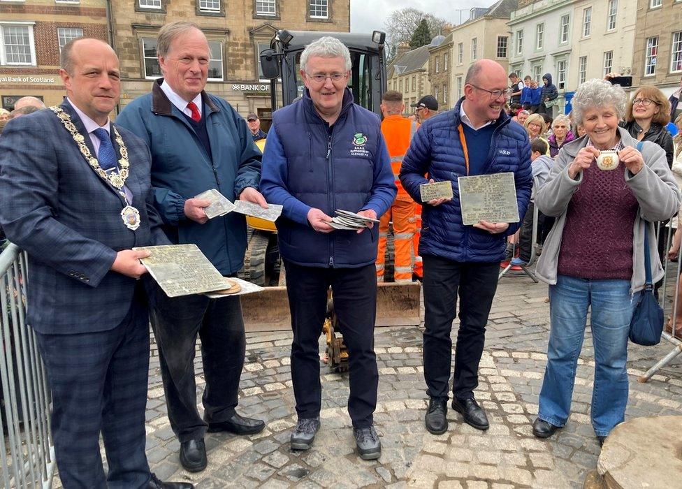 Community leaders with the items taken from the bullring time capsule