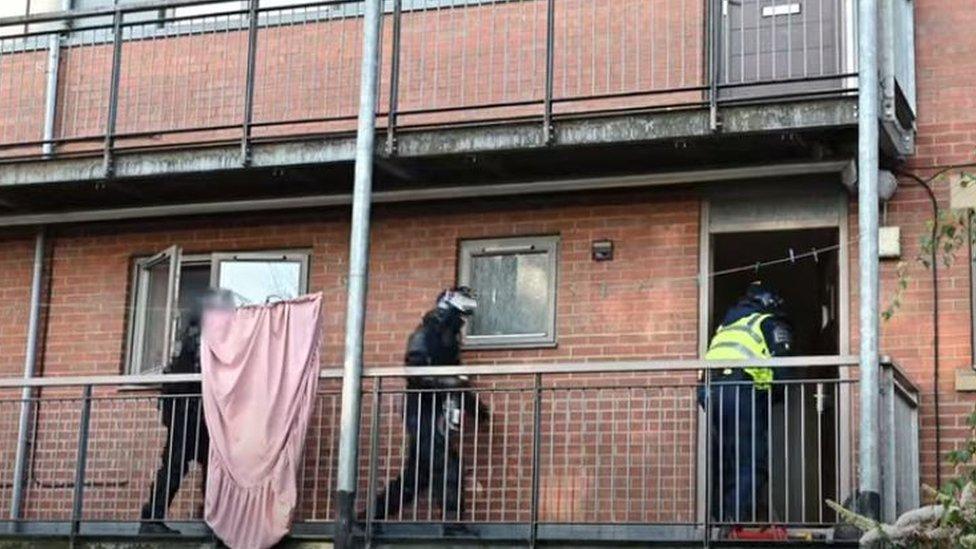 Cheshire Police entering a house to make an arrest