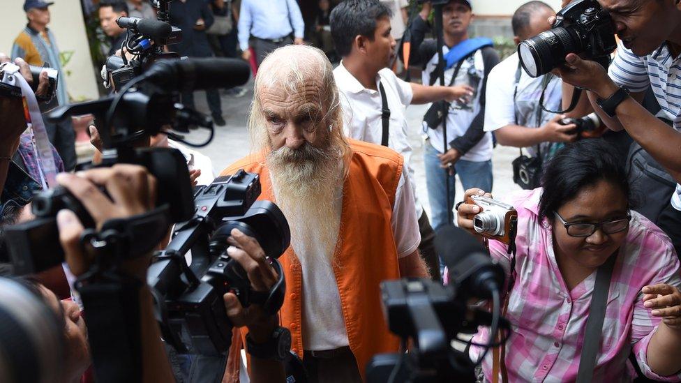 Robert Andrew Fiddes Ellis (C) of Australia arrives at a court in Denpasar on Bali island on October 25, 2016. Ellis was sentenced to 15 years in prison for molesting Indonesian children on the popular tourist island of Bali.