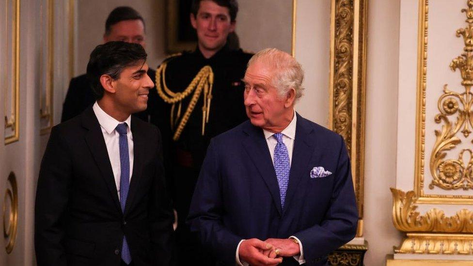 The King and Rishi Sunak engaged in conversation.