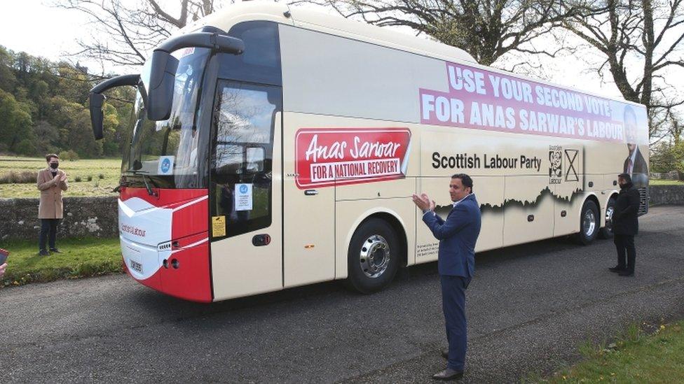 Anas Sarwar stands next to Scottish Labour's 'second vote' campaign bus