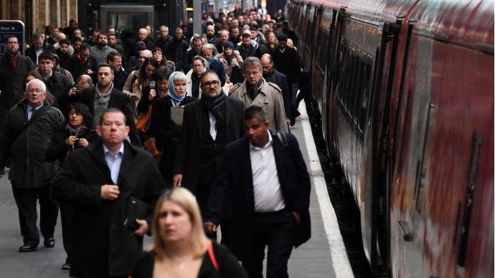 Passengers on rail platform