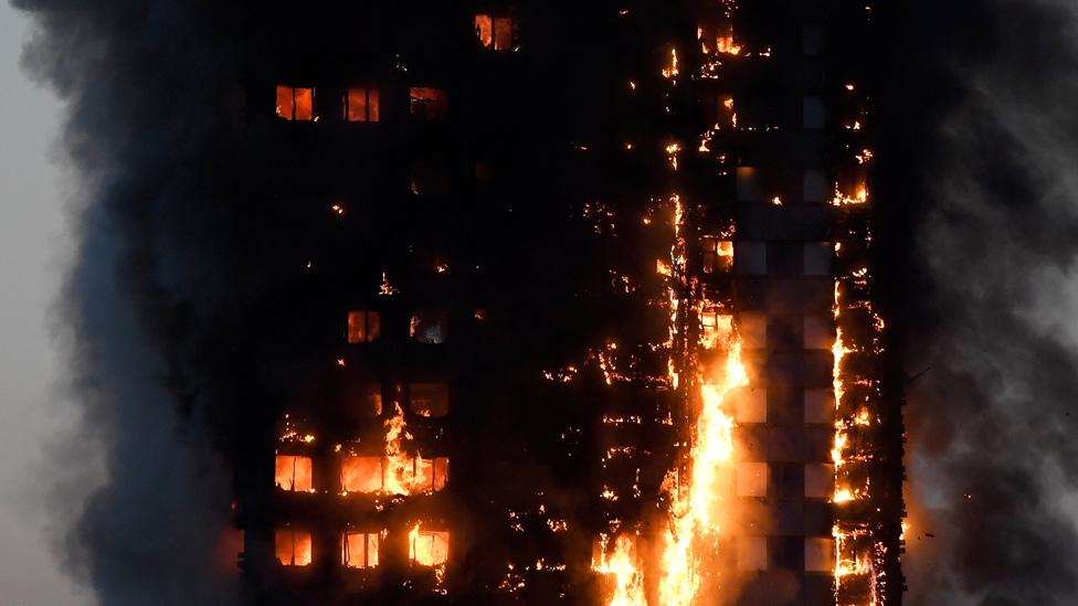 Flames and smoke billow out of Grenfell Tower