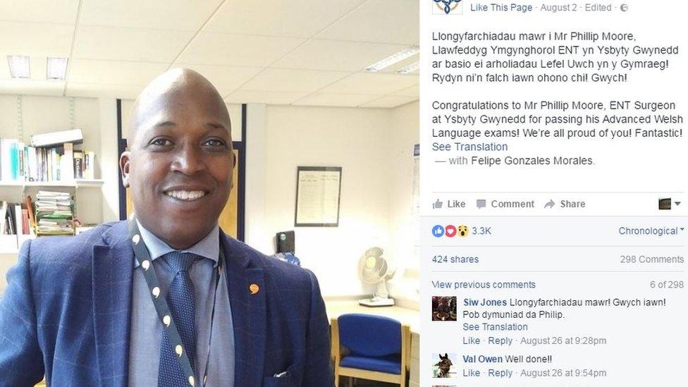 Barbadian surgeon Phillip Moore has received praise for passing his Advanced Welsh language exams