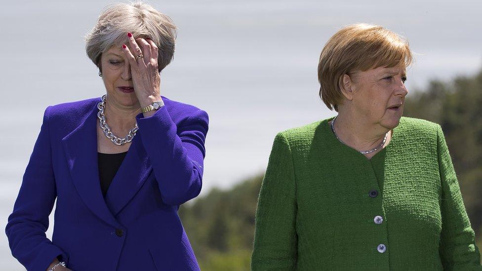 Theresa May and German Chancellor Angela Merkel at the G7 summit in Canada