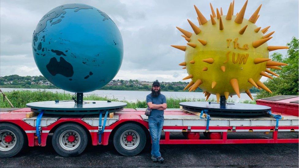 Ryan Milligan pictured with the sculptures