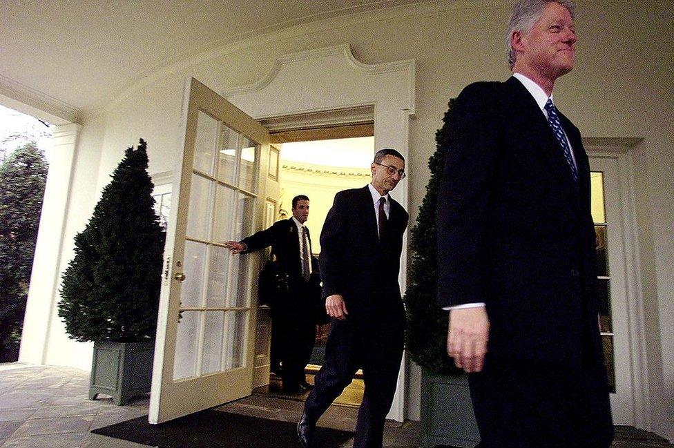 Doug Band and John Podesta leave the oval office on Bill Clinton's last day as president