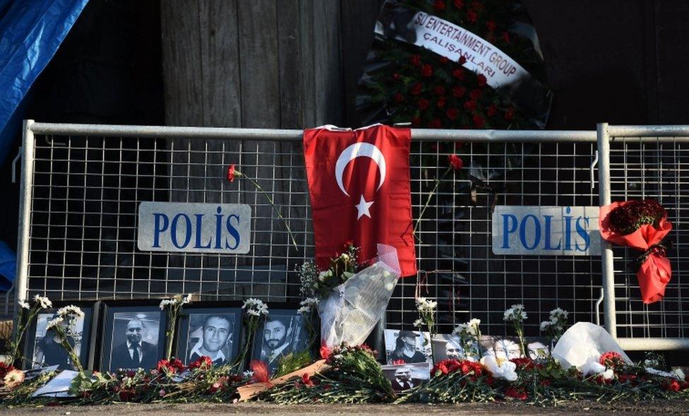 A picture taken on January 2, 2017 in Istanbul shows pictures of victims laid in front of the Reina nightclub, a day after a gunman killed 39 people, including many foreigners, in a rampage at an upmarket nightclub in Istanbul where revellers were celebrating the New Year.