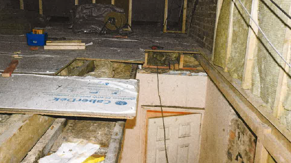 A loft going through building work, but with a lot of holes in the floor