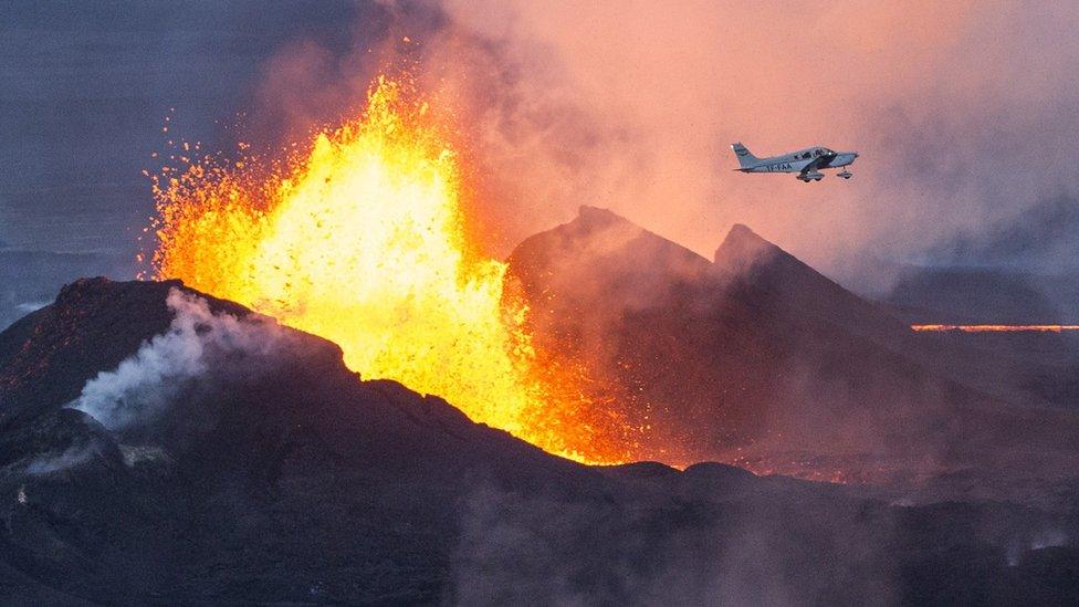 A plane flies over the Bardarbunga eruption