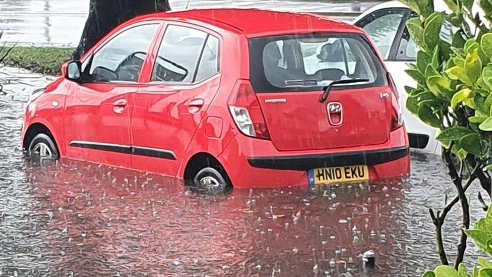 Car partially submerged in water