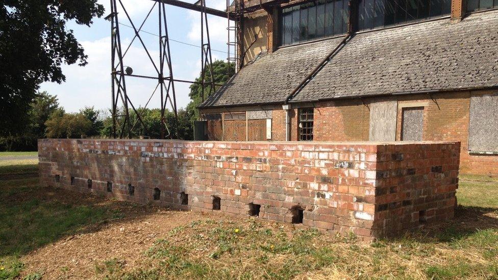 Bicester Heritage contains protected buildings such as this restored shelter