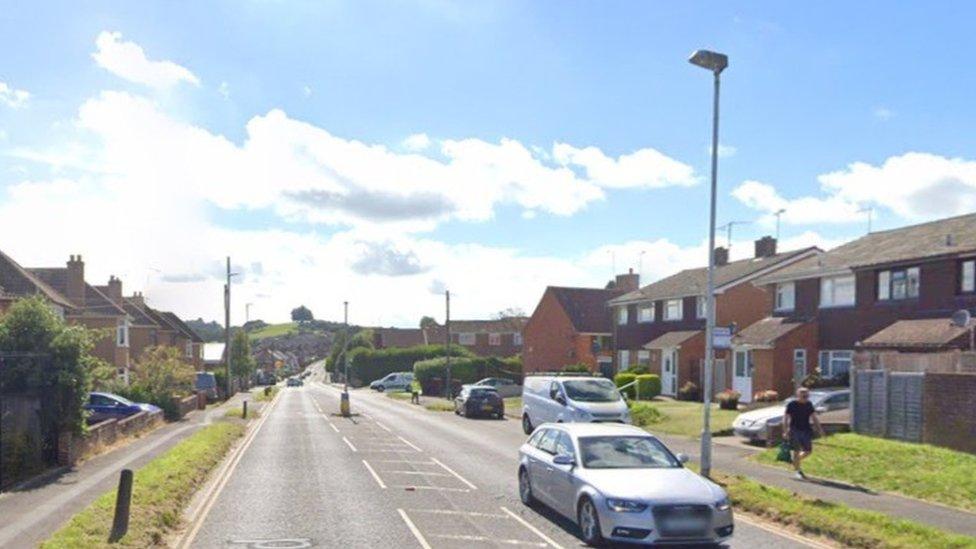 Lyde Road with cars on it on a sunny day