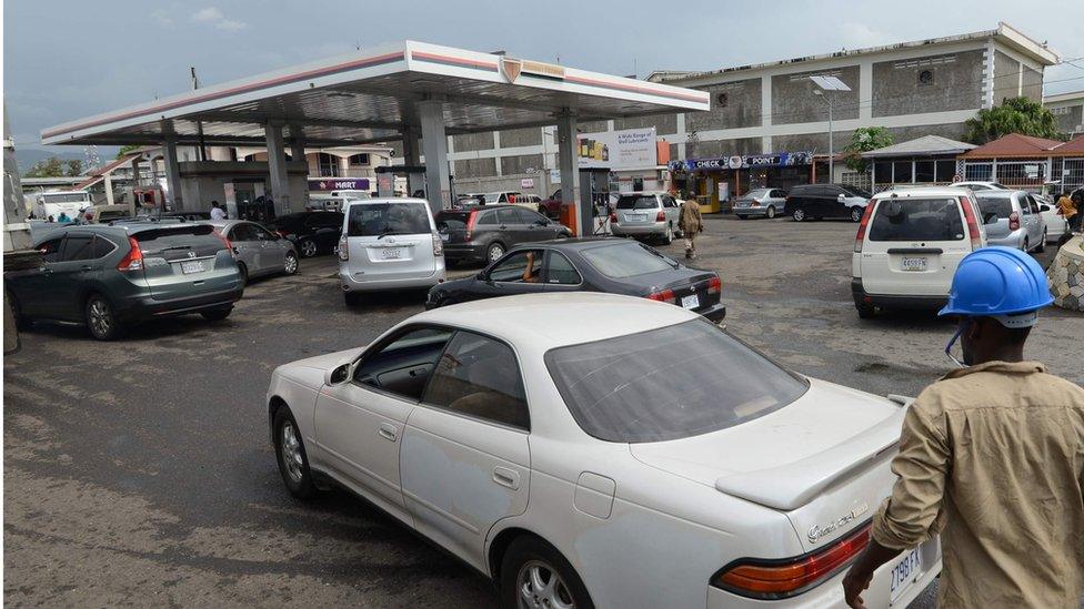 Cars queuing up at petrol station