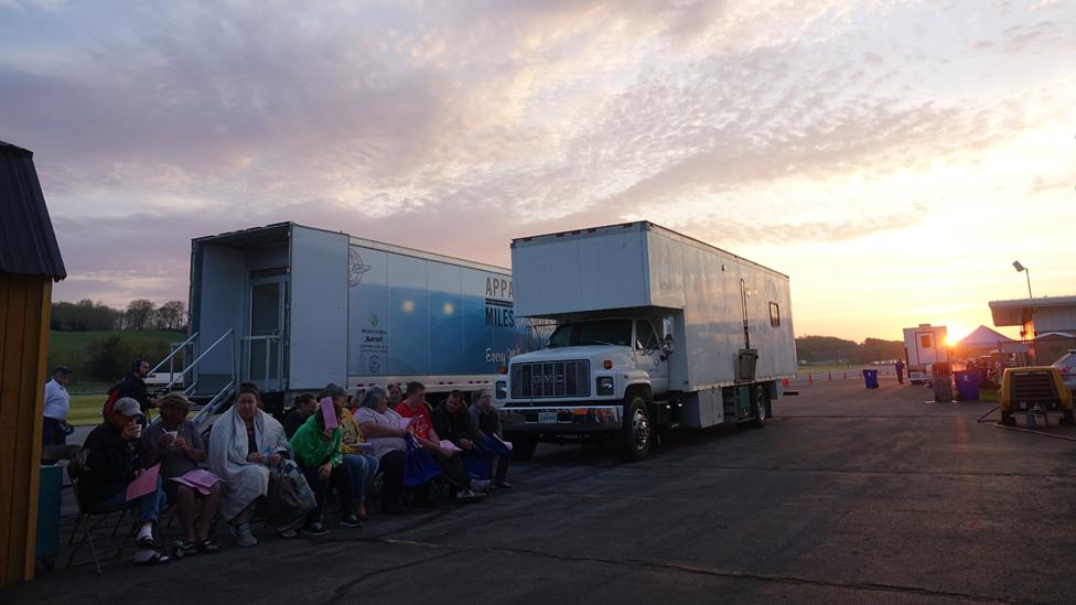 People queuing for treatment at dawn