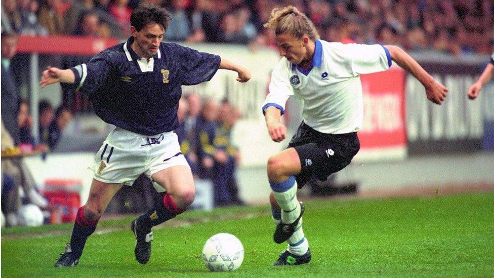 Scotland's Pat Nevin (left) battles for the ball against Risto Kallaste of Estonia during the World Cup qualifying match at Pittodrie, Aberdeen.