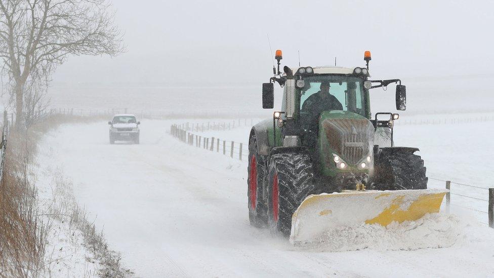 Tractor clearing snow