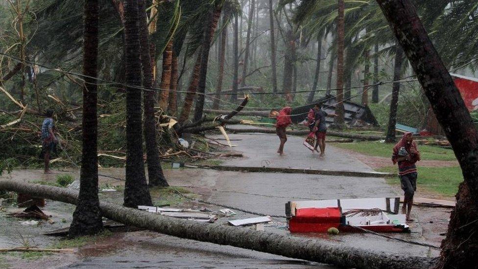 People seek shelter during the cyclone