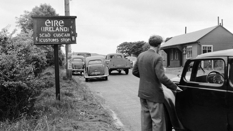 A man pictured at an Irish customs checkpoint circa 1950