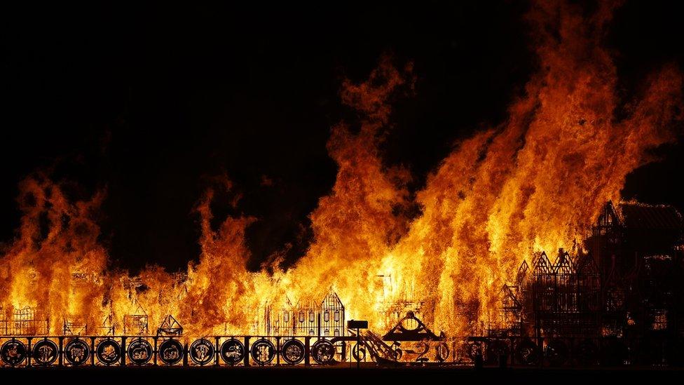 A model of London's skyline set alight