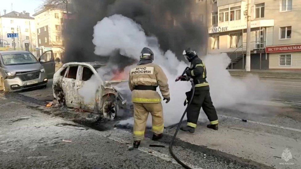 Firefighters extinguish a burning car in Belgorod