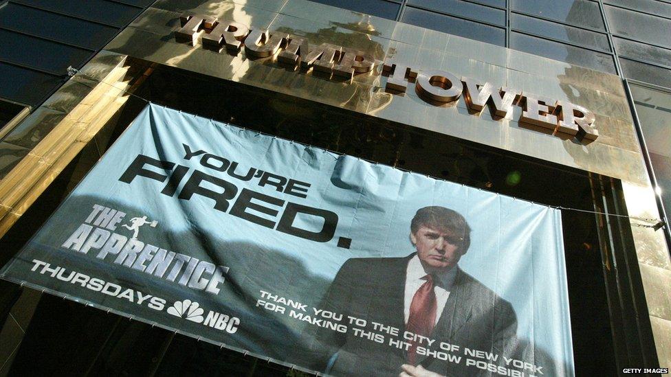 Apprentice poster in front of Trump Towers