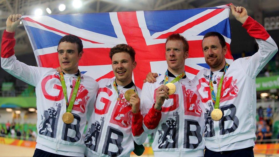 Owain Doull, Edward Clancy, Steven Burke and Bradley Wiggins with gold medals
