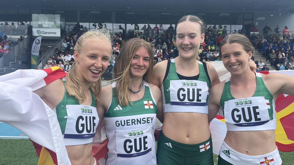 Abi Galpin (left) added two relay golds to the 200m title she won earlier in the week