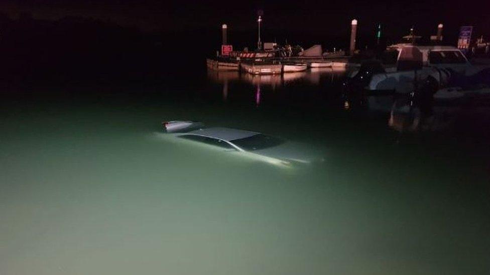 The car in the water after the accident in the New Forest