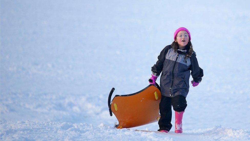 Girl with sledge