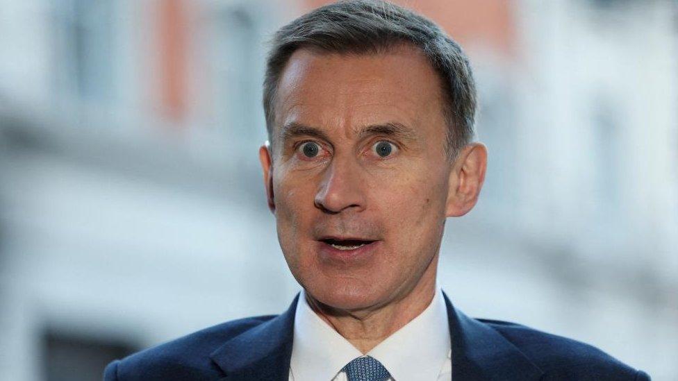 British Chancellor of the Exchequer Jeremy Hunt speaks to the media outside the BBC Broadcasting House in November