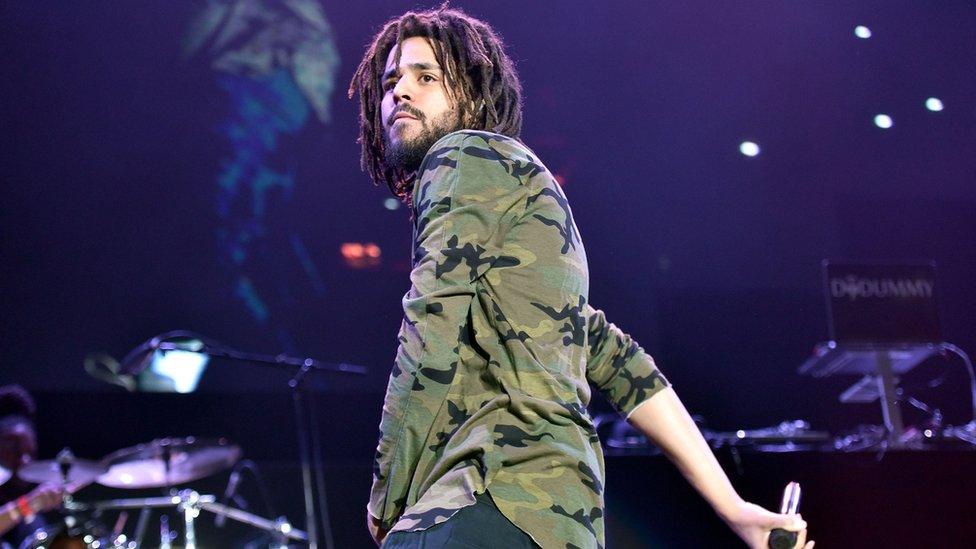 J Cole on stage