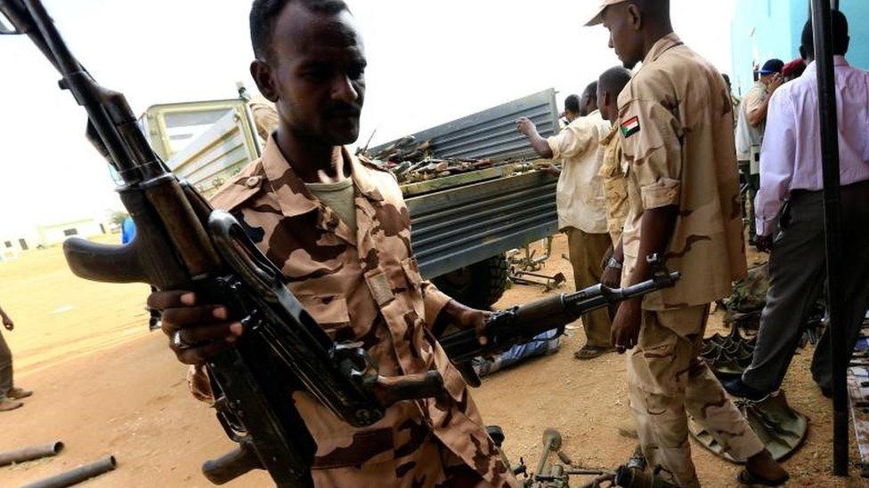 Rapid Support Forces upload disarmed weapons for display during Sudanese President Omar al-Bashir visit to the war-torn Darfur region at Rapid Support Forces Headquarter in Umm Al-Qura, Darfur, Sudan September 23, 2017