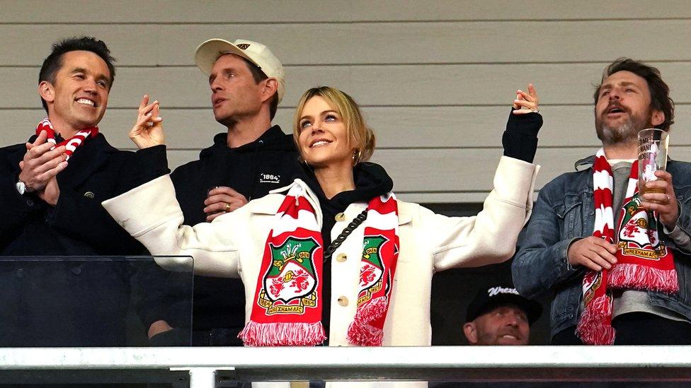 Wrexham owner Rob McElhenney (left), Glenn Howerton, Kaitlin Olson and Charlie Day during the Vanarama National League match at The Racecourse Ground, Wrexham