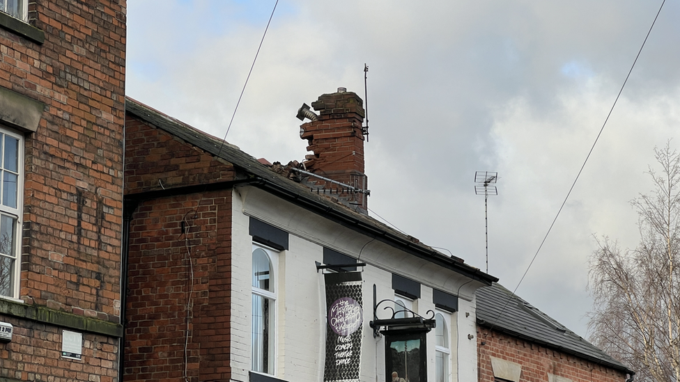 Damaged chimney of pub