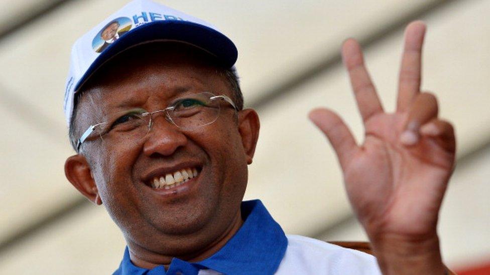 Hery Rajaonarimampianina of Hery Vaovao ho an'i Madagasikara party flashes his party on December 18, 2013 during a rally ahead of the upcoming presidential election on December 20.